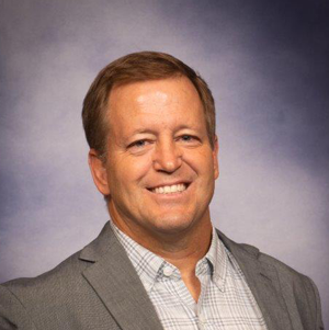 A professional headshot of UTK faculty member John Bell