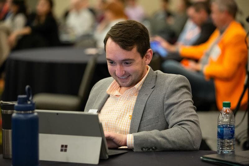 A supply chain professionals looking at a laptop.