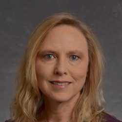 A professional headshot of UTK faculty member, Kelly Hewett