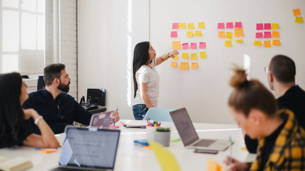 Young professional leads a team business meeting.